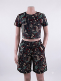 Batik floral swirl African print matching set — black with teal, burgundy and cream, crop top and shorts on mannequin