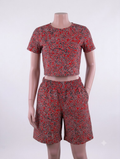 Red swirl abstract African print matching set — red with black and gold, crop top and shorts on mannequin