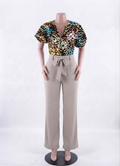 African print wrap top with deep V-neck and wide-leg beige pants with belt tie, mannequin shot